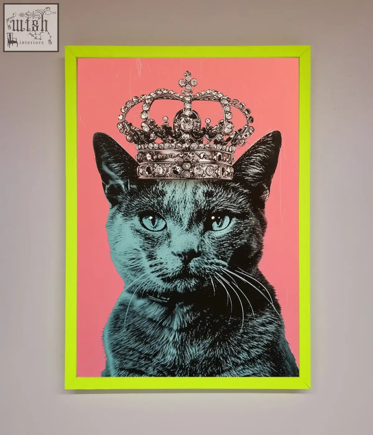 A majesty cat framed print of a black cat with teal eyes and silver crown in a neon green frame on pink background