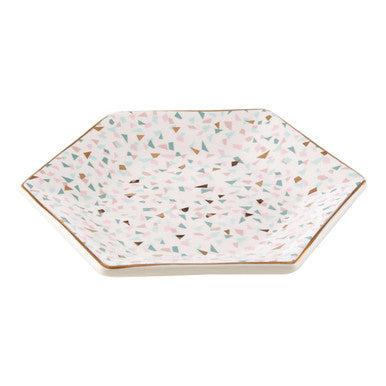 Hexagonal ceramic trinket dish with a white base and multicolored triangular speckles in yuki terrazzo pattern