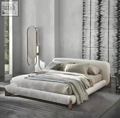 Modern yukina bed with a sculptural frame wrapped in soft off-white fabric and wooden legs for stylish comfort