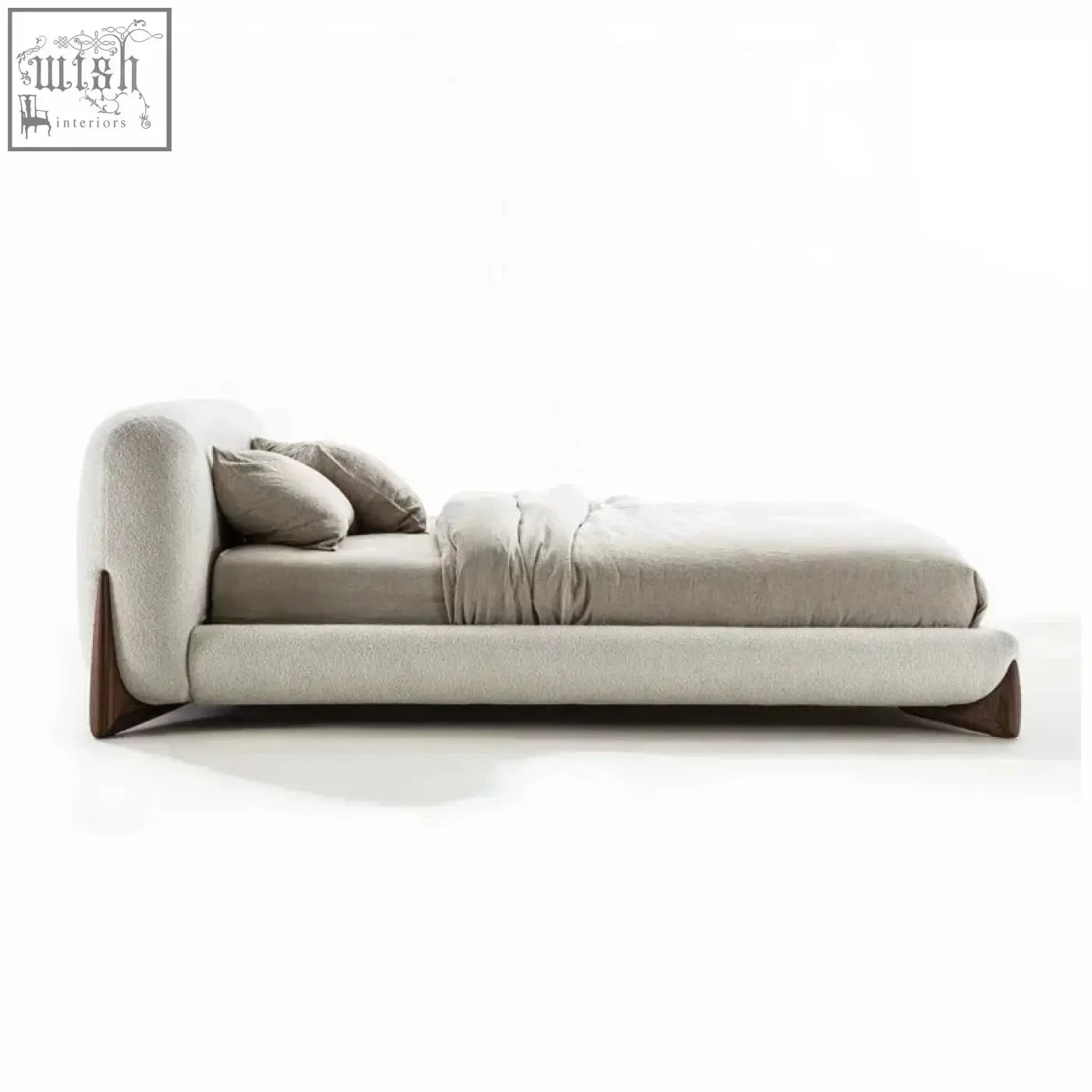 Modern yukina bed with sculptural frame wrapped in soft light gray fabric and sleek dark wood legs