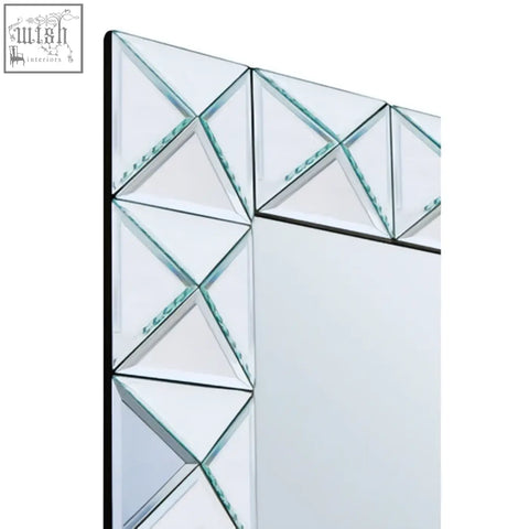Geometric yula pyramid wall mirror with black frame and triangular glass panels in an intricate pattern