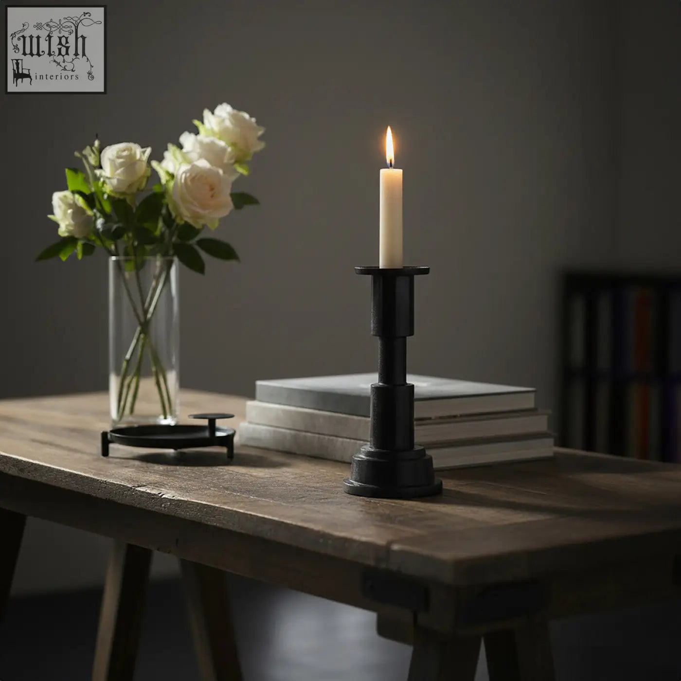 Black metal zac small candle holder with a lit white small candle inside for cozy decor lighting