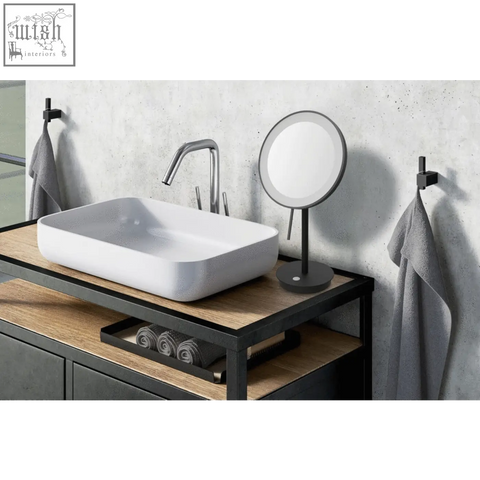 White rectangular vessel sink with smooth ceramic finish shown alongside black stainless steel led cosmetic mirror Zack Alona