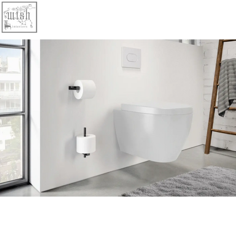 White wall-mounted toilet with sleek design paired with zack carvo powder coated black stainless steel spare toilet roll holder