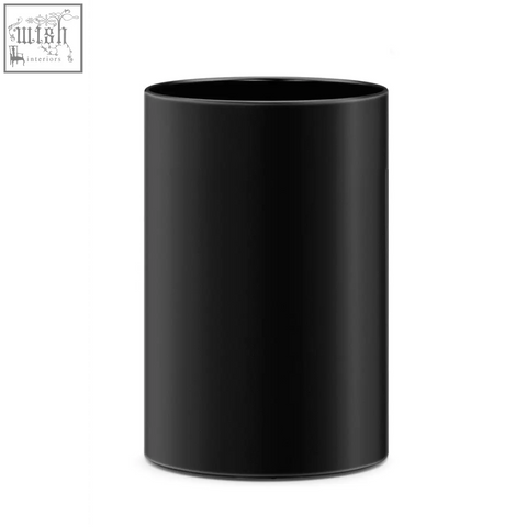 Black cylindrical mug with smooth glossy finish next to zack civos black stainless steel round waste paper basket