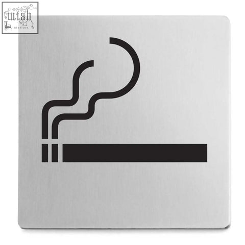 Silver metallic indici information sign with black cigarette silhouette made of brushed stainless steel for smoking permitted areas