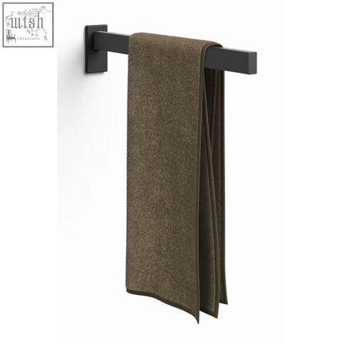 A plush olive green towel hangs on the sleek black stainless steel zack linea towel holder 42 cm
