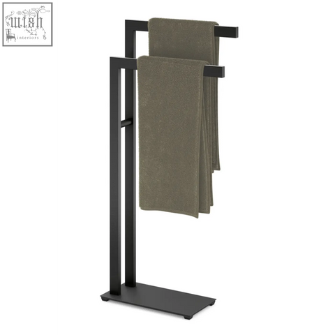 Black stainless steel linea towel stand with double-tier bars and two olive green towels hanging on it
