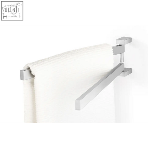 Modern chrome finished linea towel holder in stainless steel with a sleek angular design holding a plush white towel