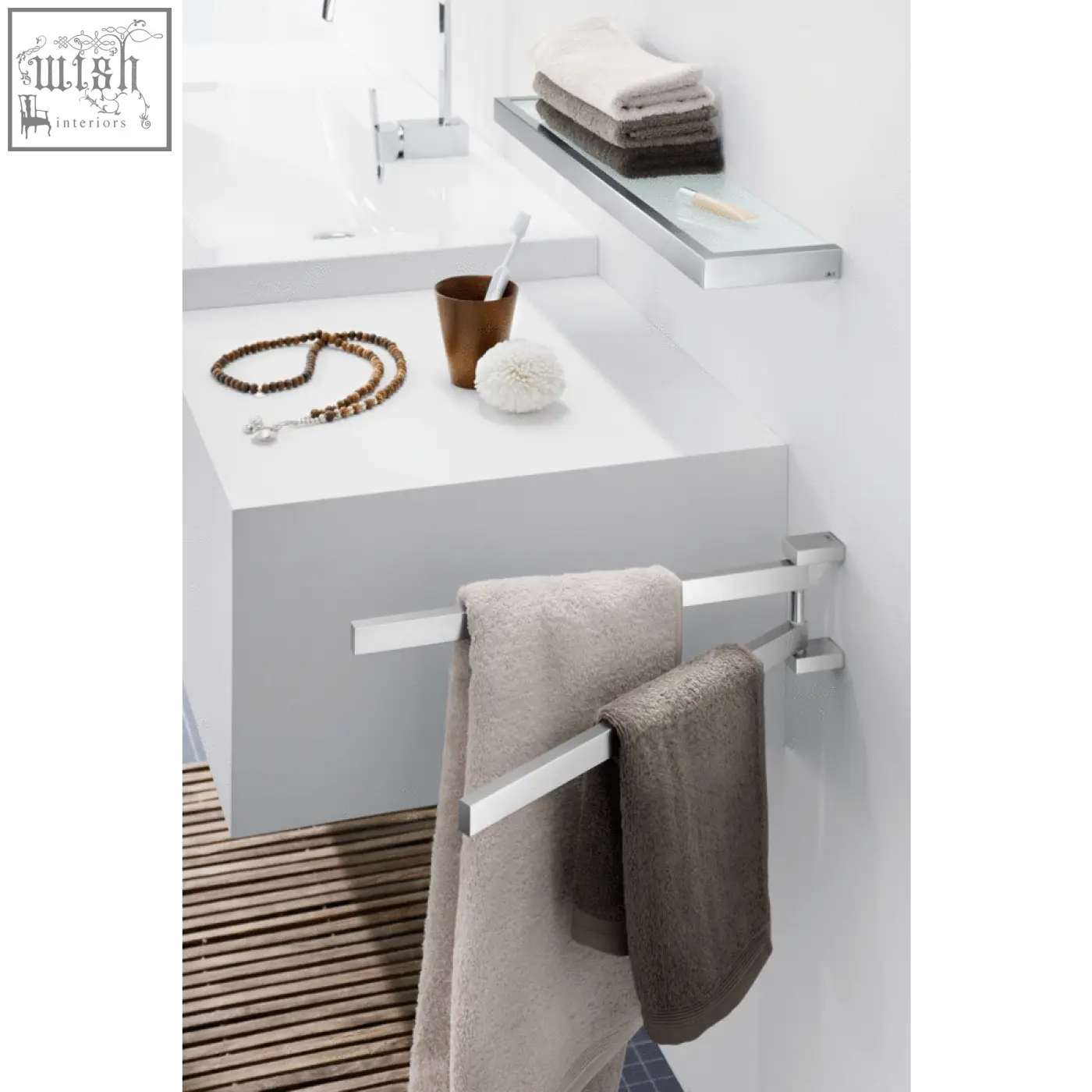 Modern chrome finished linea towel holder in stainless steel holding beige and gray towels for bathroom use