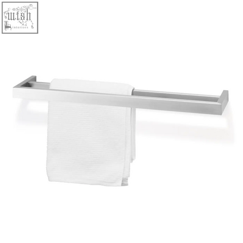 Silver stainless steel zack linea 61.5 cm double towel rail holding a white textured towel with sleek modern design