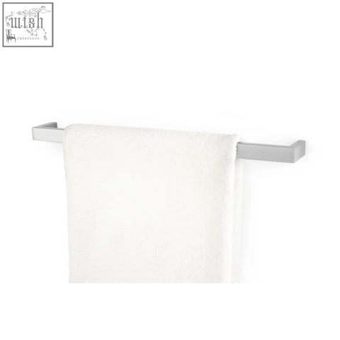 A sleek silver stainless steel linea towel rail 61.5 cm holding a soft white terry cloth towel