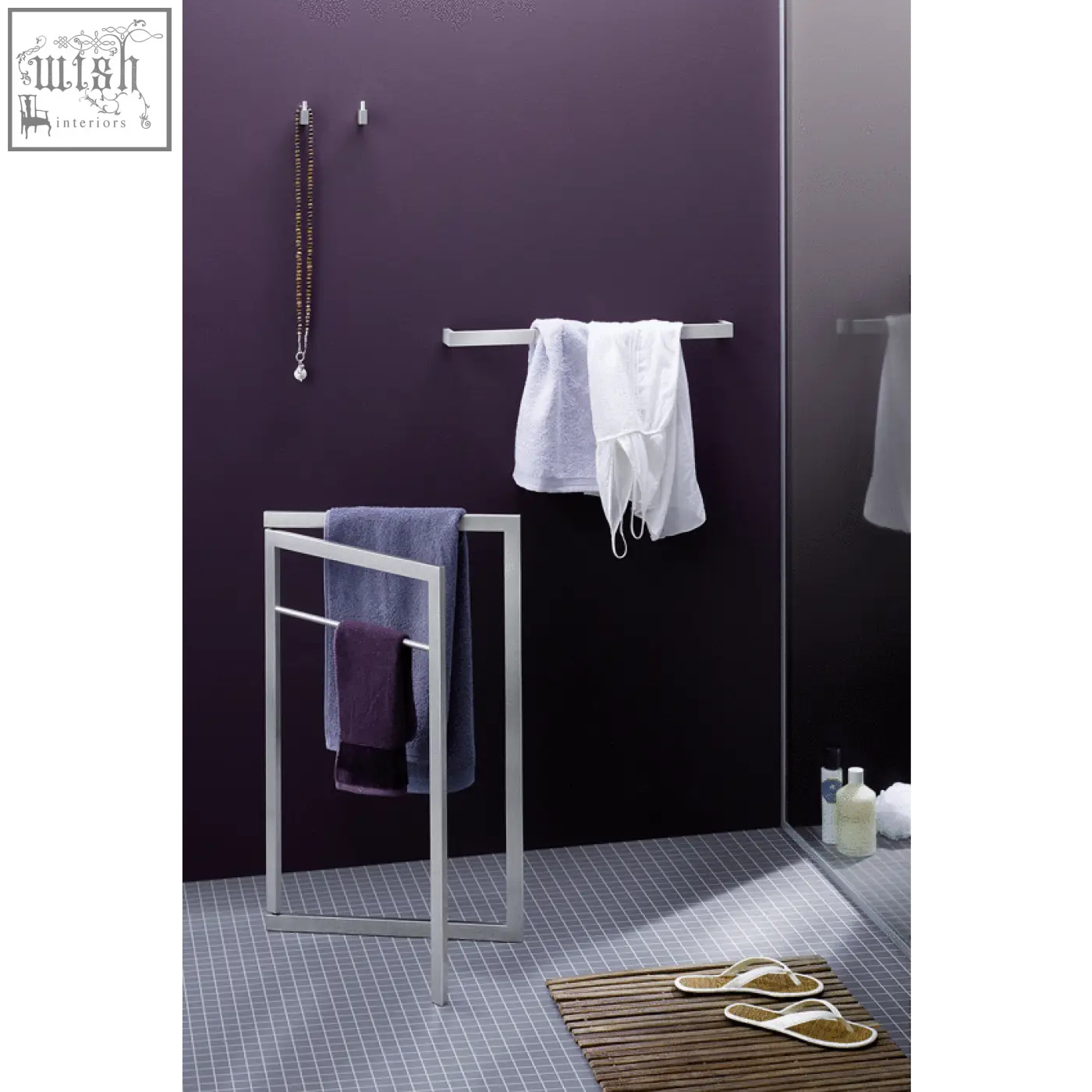 Modern silver-toned stainless steel linea towel rail with minimalist geometric frame design for bathroom use