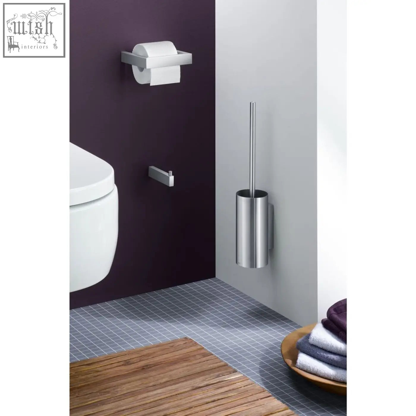 Silver cylindrical toilet brush holder with sleek brushed stainless steel finish perfect for modern bathrooms