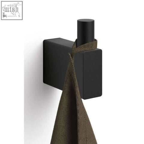 Black matte linea towel hook with cylindrical peg holding olive green towel stainless steel premium quality