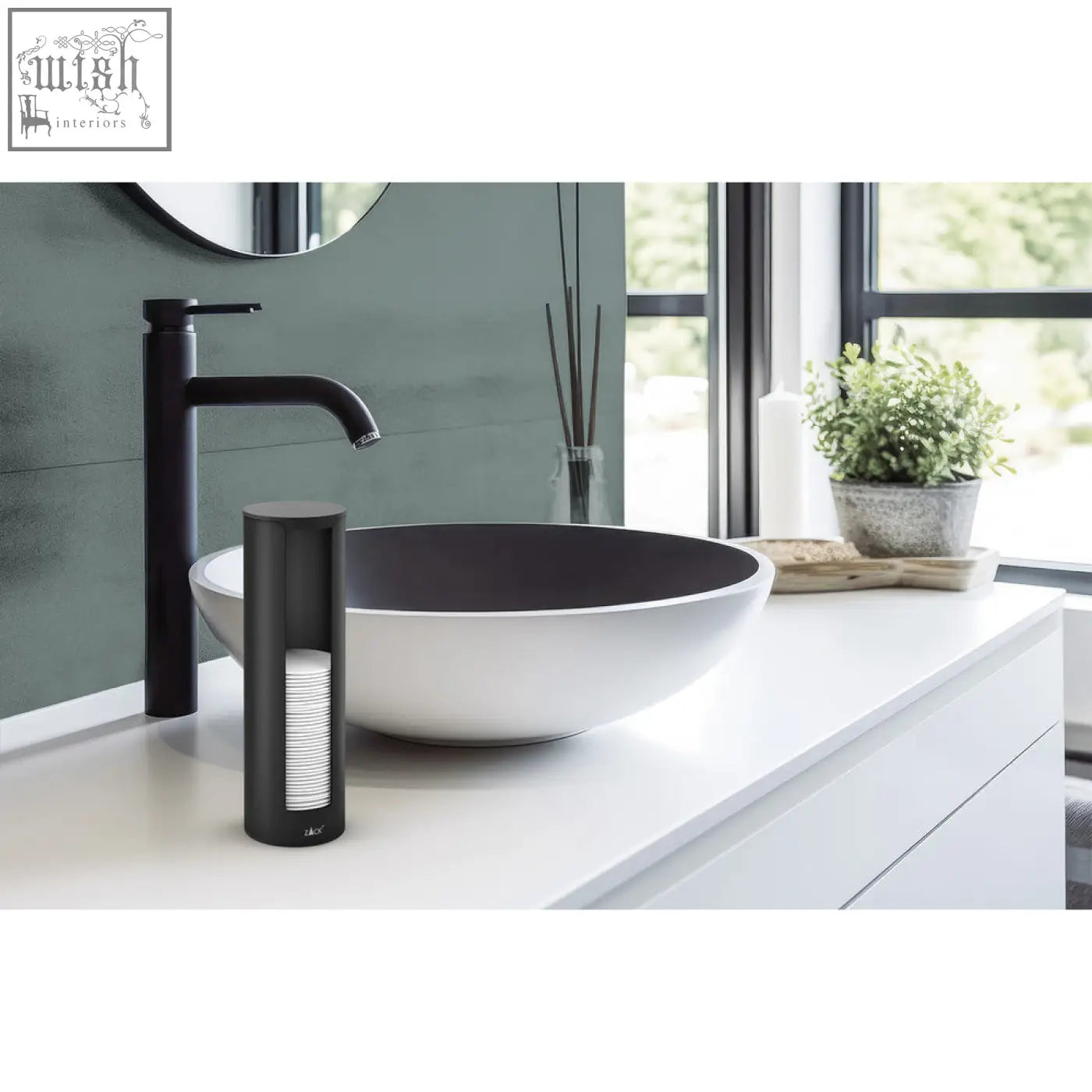 Black cylindrical cotton pad dispenser with matte finish showing stacked white cotton pads inside by zack olomo