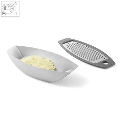Silver stainless steel parna cheese grater with matching bowl filled with grated cheese for easy shredding