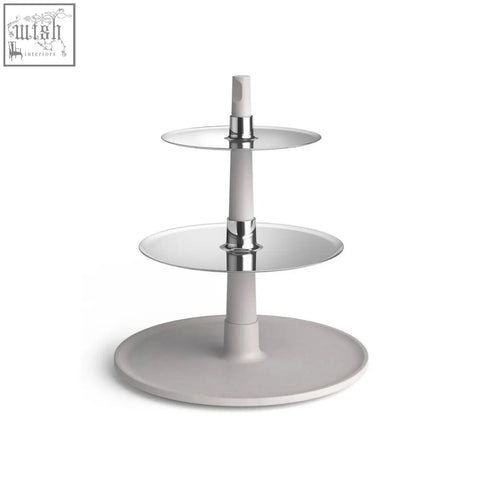 Modern three-tiered dessert stand with stainless steel plates and unsealed concrete column by zack patore