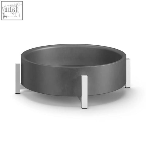 Modern gray concrete fire pit with sleek silver metal legs paired with perto bowl brushed stainless steel decor