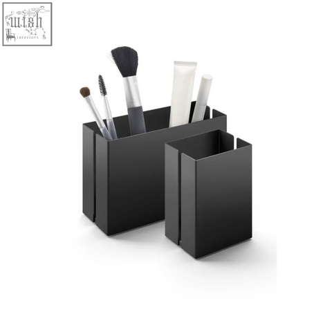 Black stainless steel makeup utensil box by Zack Potes with minimalist design and matte finish for brush storage