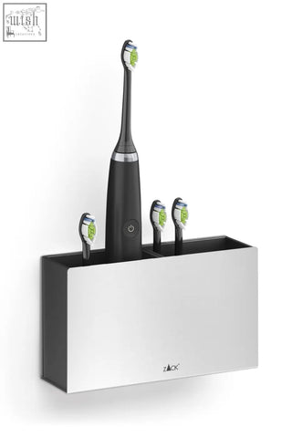 Black and silver zack electric toothbrush with green bristles in stainless steel potes toothbrush holder on wall mount
