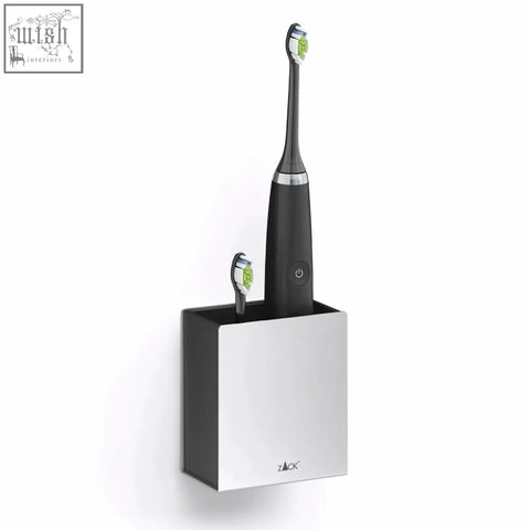 Black and silver electric toothbrush with green bristles in sleek zack potes stainless steel wall-mounted toothbrush holder