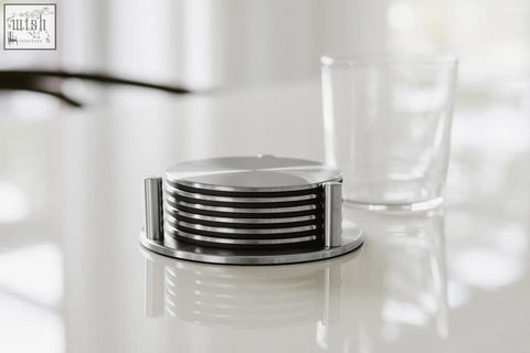 Zack regio brushed stainless steel coaster set with sleek modern design and concentric circular grooves in silver