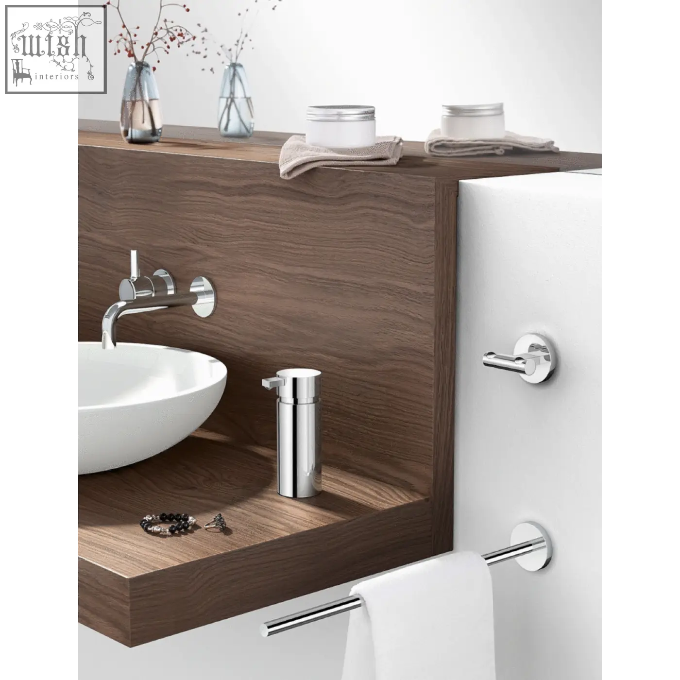Chrome-finished cylindrical soap dispenser next to zack scala towel holder in polished stainless steel for bathroom elegance