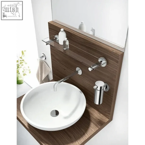 White ceramic vessel sink with polished chrome drain paired with Zack Scala stainless steel soap dispenser