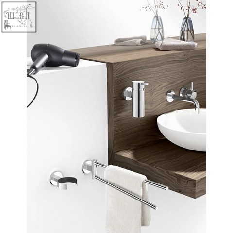 Chrome-finished stainless steel swivelling towel holder with double bars mounted on white wall for modern bathrooms