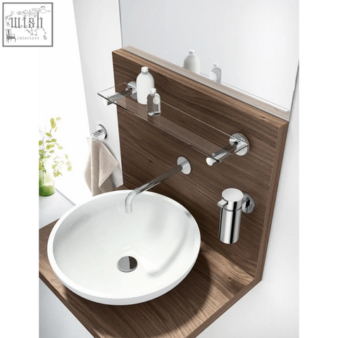 White ceramic vessel sink with chrome faucet on wood vanity featuring scala towel hook stainless steel bathroom accessory