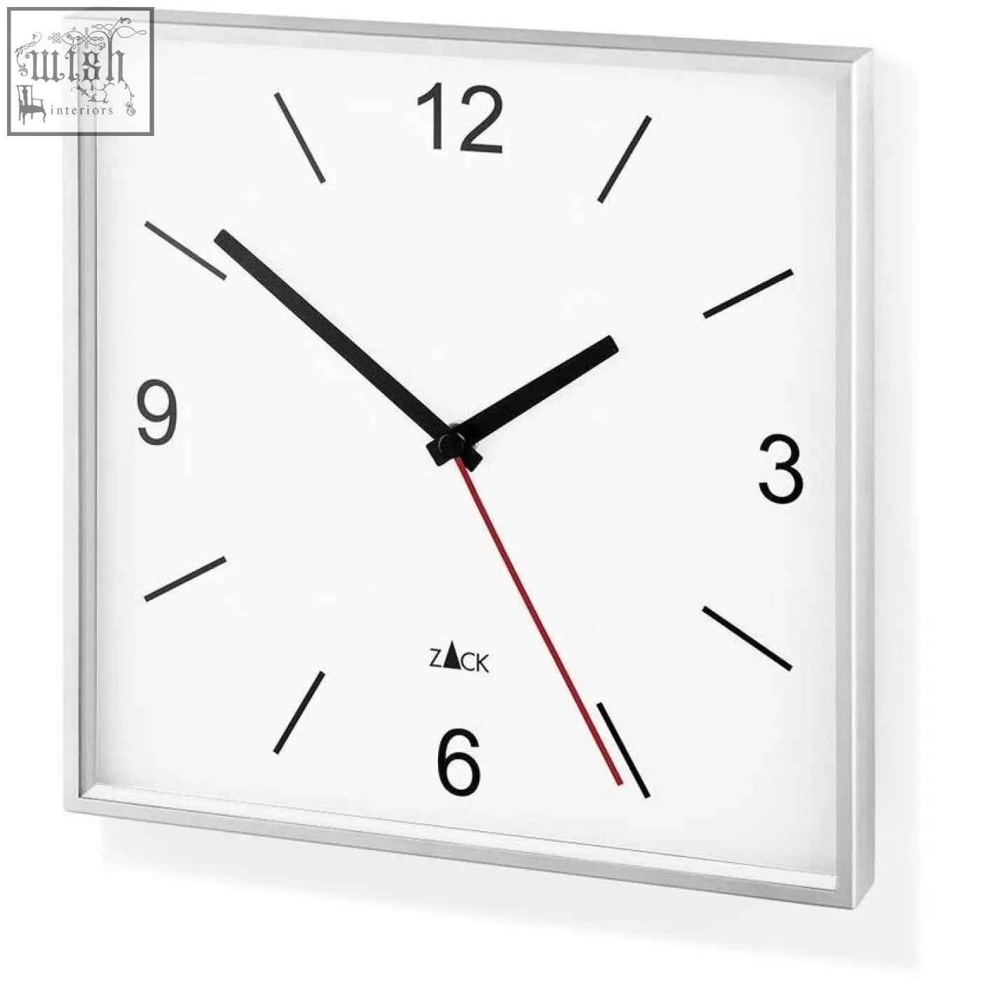 Square stainless steel wall clock with black and red hands and bold numerals in the sillar wall collection