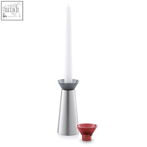 Silver candle holder with white taper candle and red glass cup from zack taris stainless steel collection