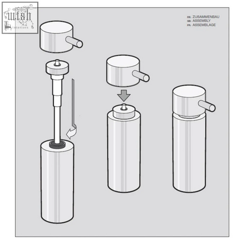 Silver cylindrical tico soap dispenser in polished stainless steel with a sleek push-button top design