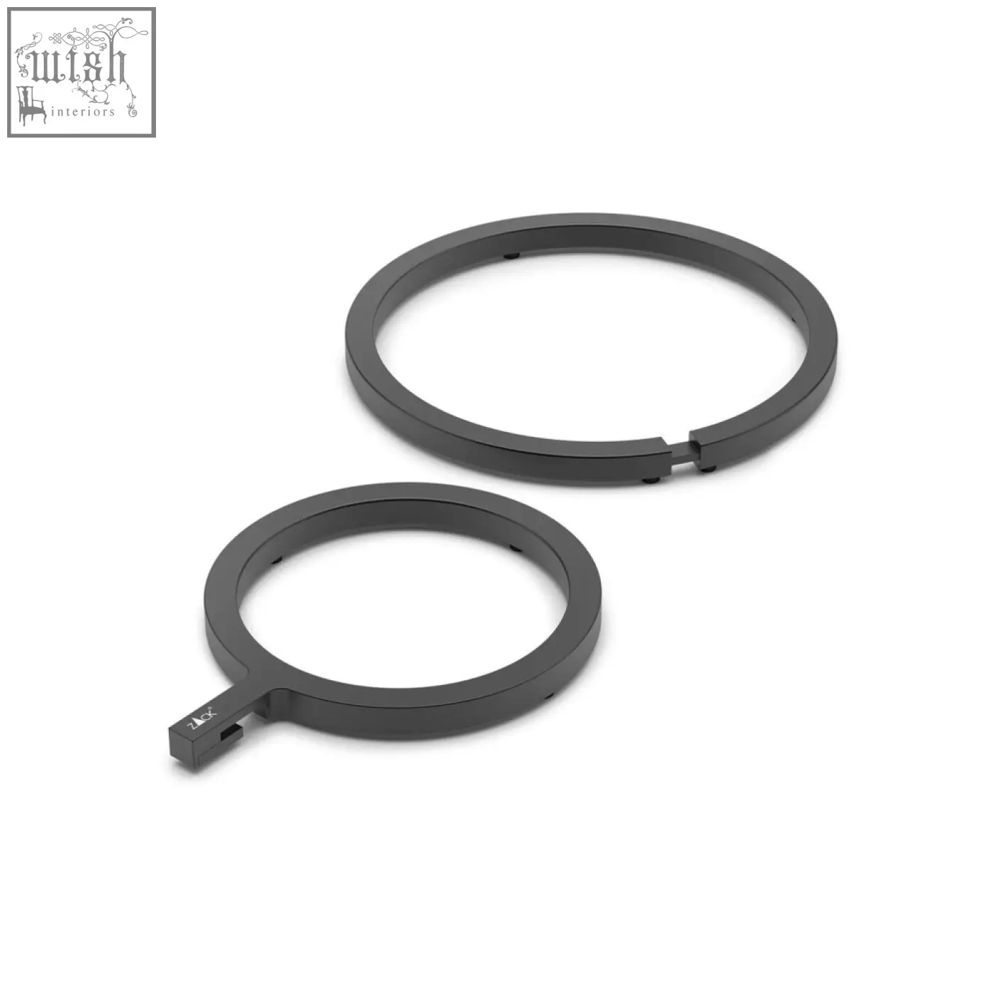 Dark grey vargo table trivet made of anodised aluminium with a black metallic ring and small rectangular attachment