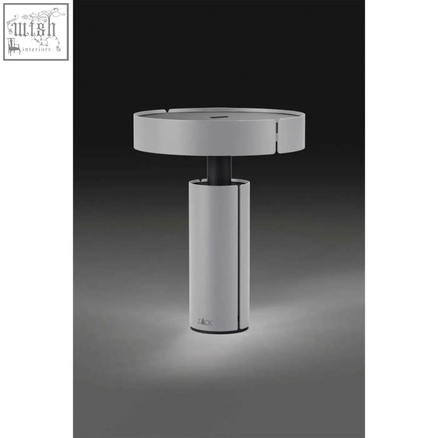 Modern white cylindrical led table lamp with sleek black stem and rechargeable stainless steel design by zack yaro