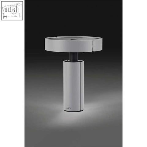Modern white cylindrical led table lamp with sleek black stem and rechargeable stainless steel design by zack yaro