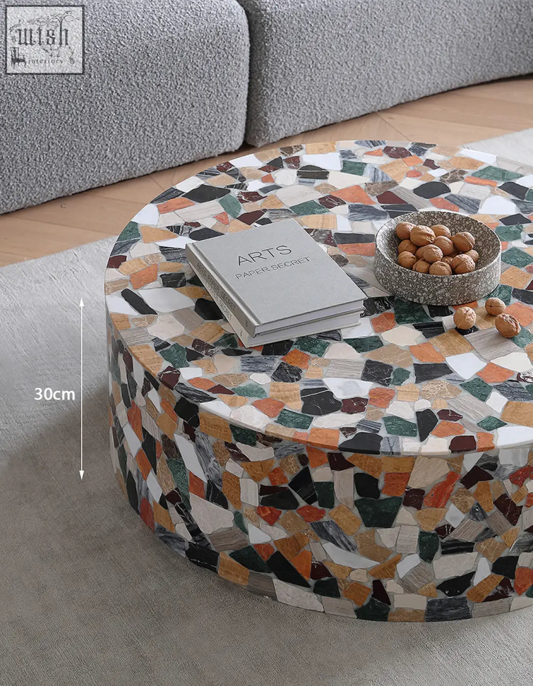 Zahra modern coffee table with a circular mosaic marble top in white black green orange and brown colors for stylish living spaces