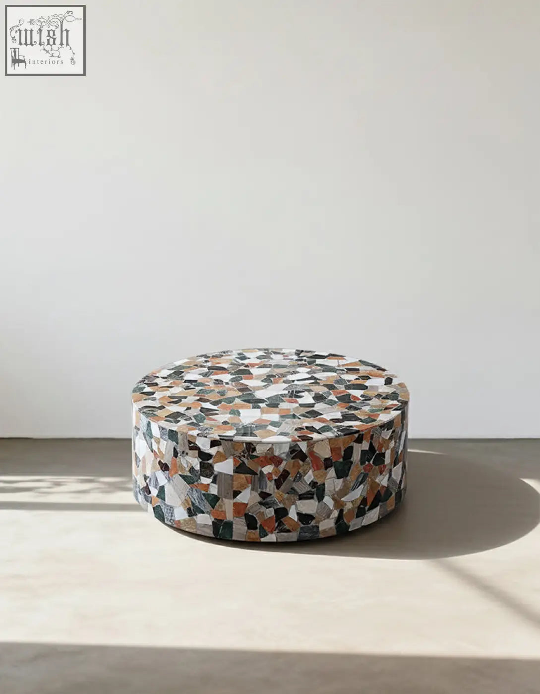 Circular mosaic coffee table with black white gray and terracotta stone fragments in zahra modern coffee table marble