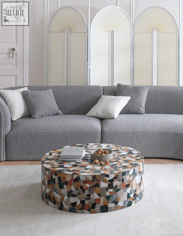 Circular zahra modern coffee table with terrazzo marble mosaic surface in earthy beige orange black and green tones