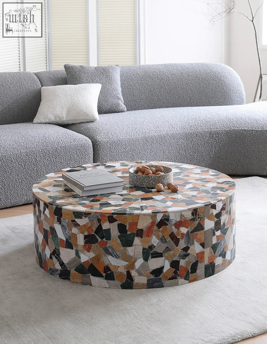 Zahra modern coffee table with a circular mosaic surface in terracotta marble tones perfect for stylish living rooms