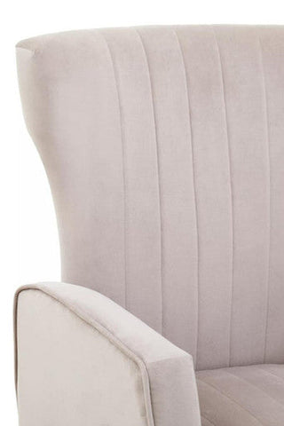 Beige mink velvet accent chair with vertical pleats curved armrest and gold finish legs for stylish seating