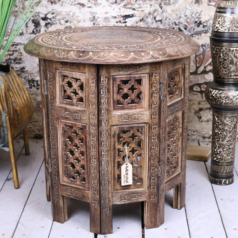 Rustic dark brown zanskar small hand carved wooden side table with intricate carved panels and circular inlay top