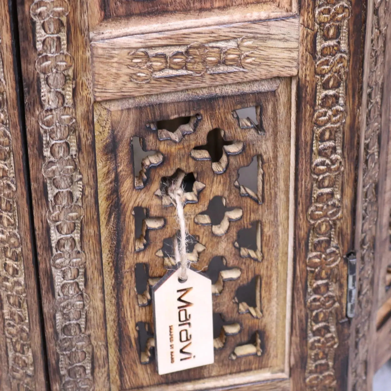 Zanskar small hand carved wooden side table with intricate floral and geometric patterns in warm brown finish