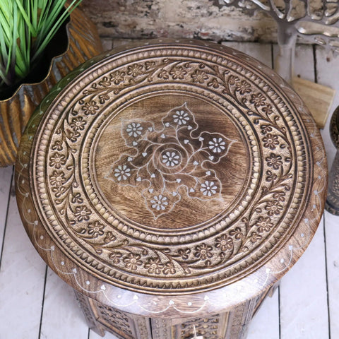 Zanskar small hand carved wooden side table with intricate floral vine patterns and white inlay starburst design