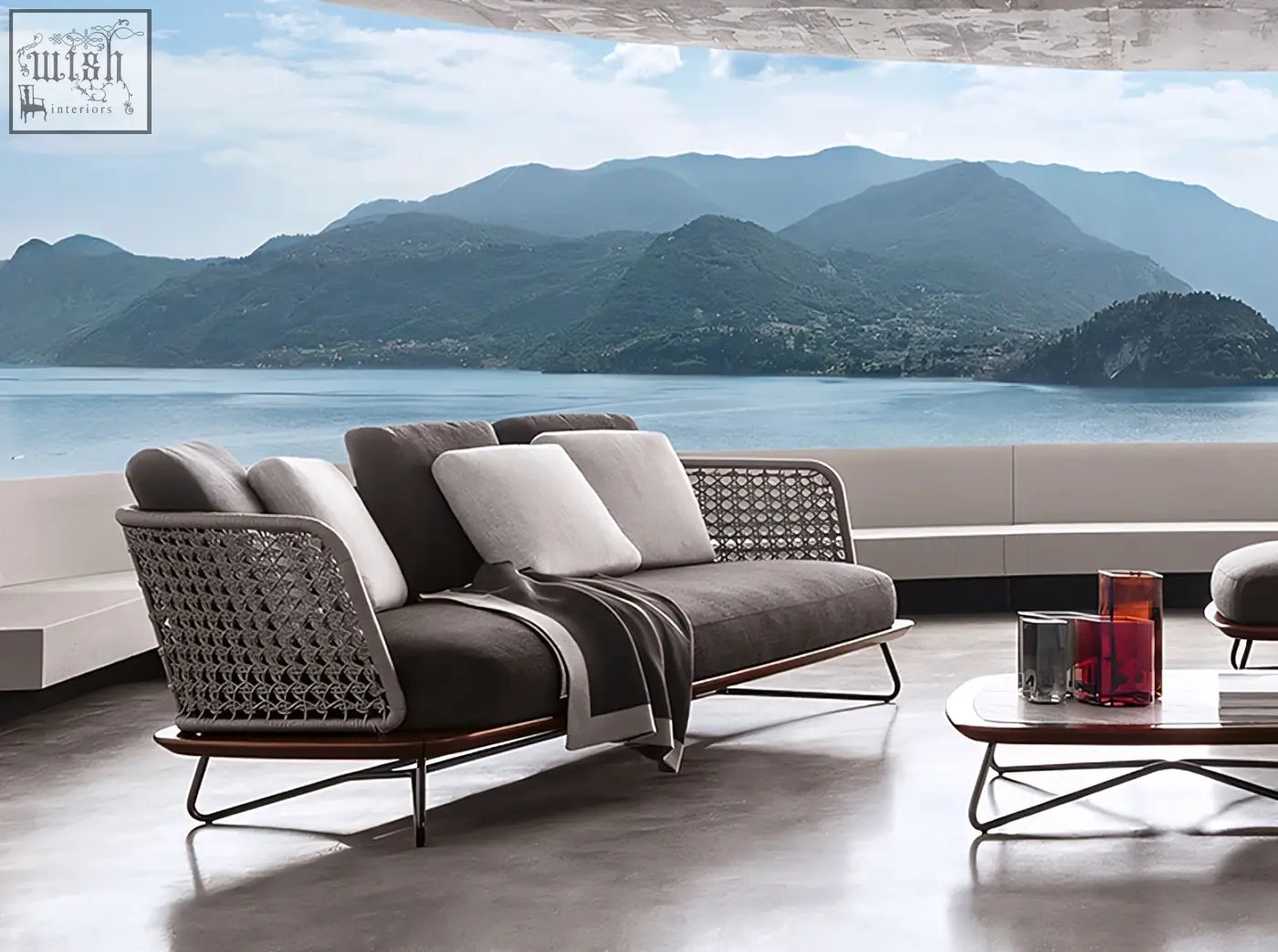 Modern gray woven wicker zarina outdoor sofa with dark brown cushions and matching throw blanket outdoor sofa set