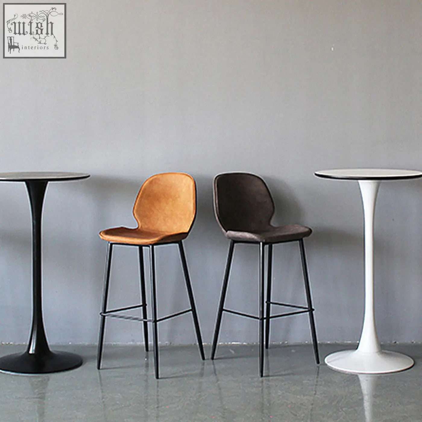 Two zavier bar stools with painted steel frames and velvet seats in warm tan and dark brown colors