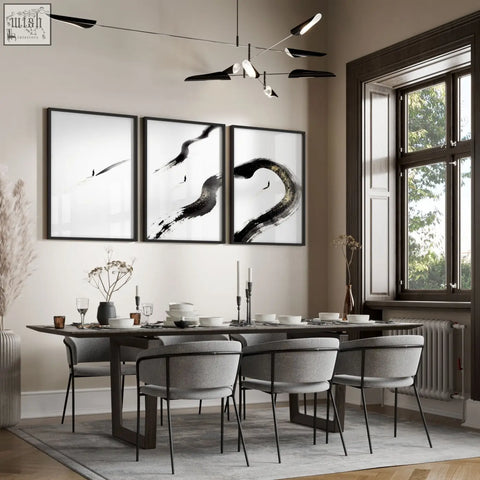 Three framed black and white zen wall decor prints with bold ink brushstrokes and lone figure above dining room table