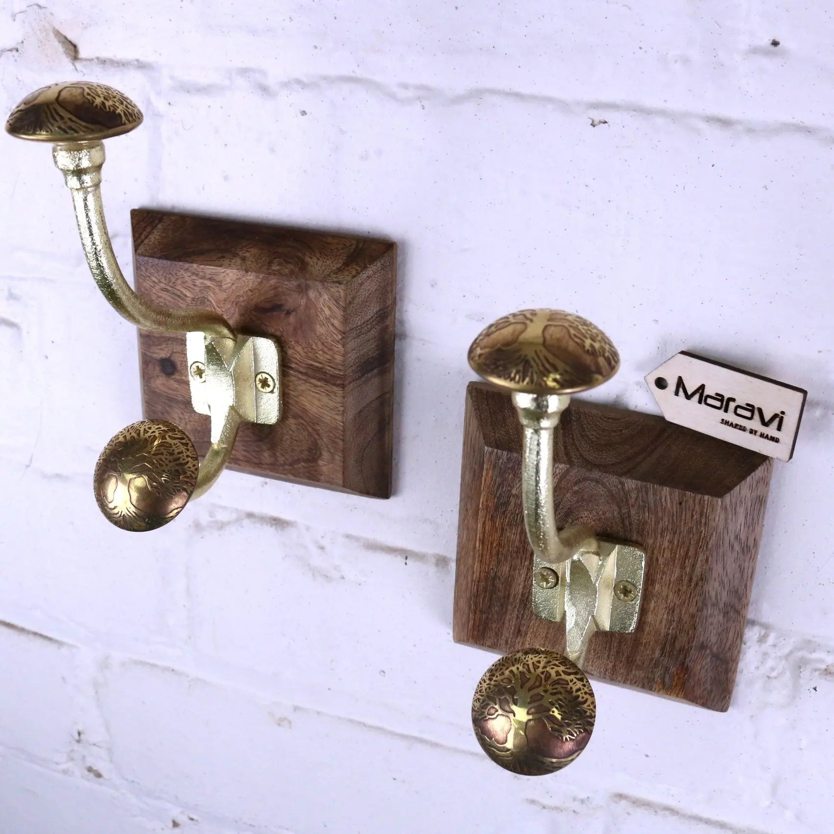 Zerika antique gold coat hooks set of 2 with brass double hooks and intricate engravings on dark wood block mount