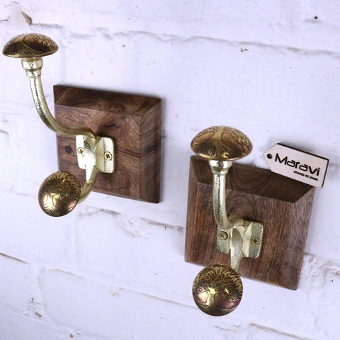 Zerika antique gold coat hooks set of 2 with brass double hooks and intricate engravings on dark wood block mount